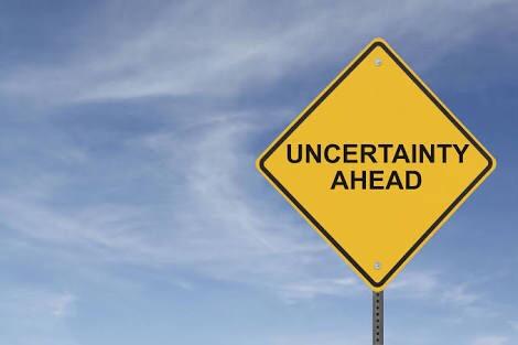Warning sign labeled "Uncertainty Ahead"
