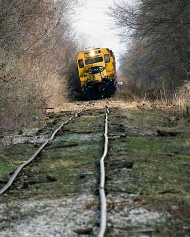 Diesel train engine struggles to stay on dilappidated road bed