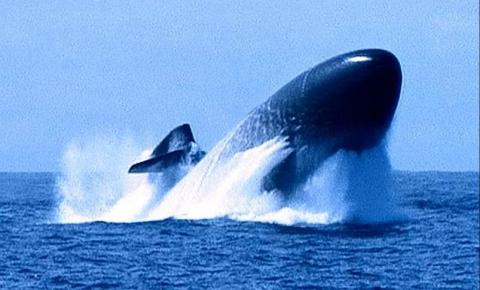 A US Navy nuclear submarine pops above surface in emergency rise situation