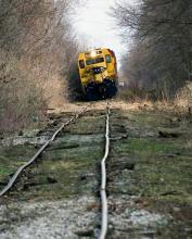 Diesel railorad engine attempting to travel along extremely poor roadbed